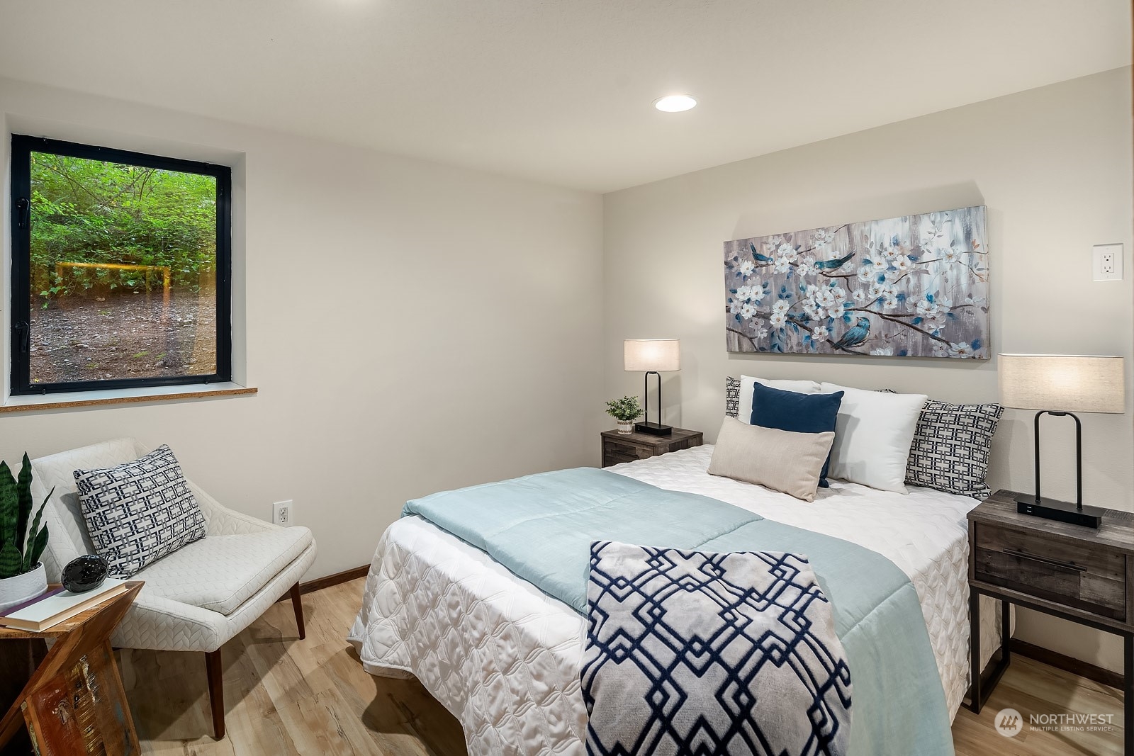 16117 Southeast 145th Place Renton, WA 98059 - Photo 29 of 38 a bedroom with a bed and a chair