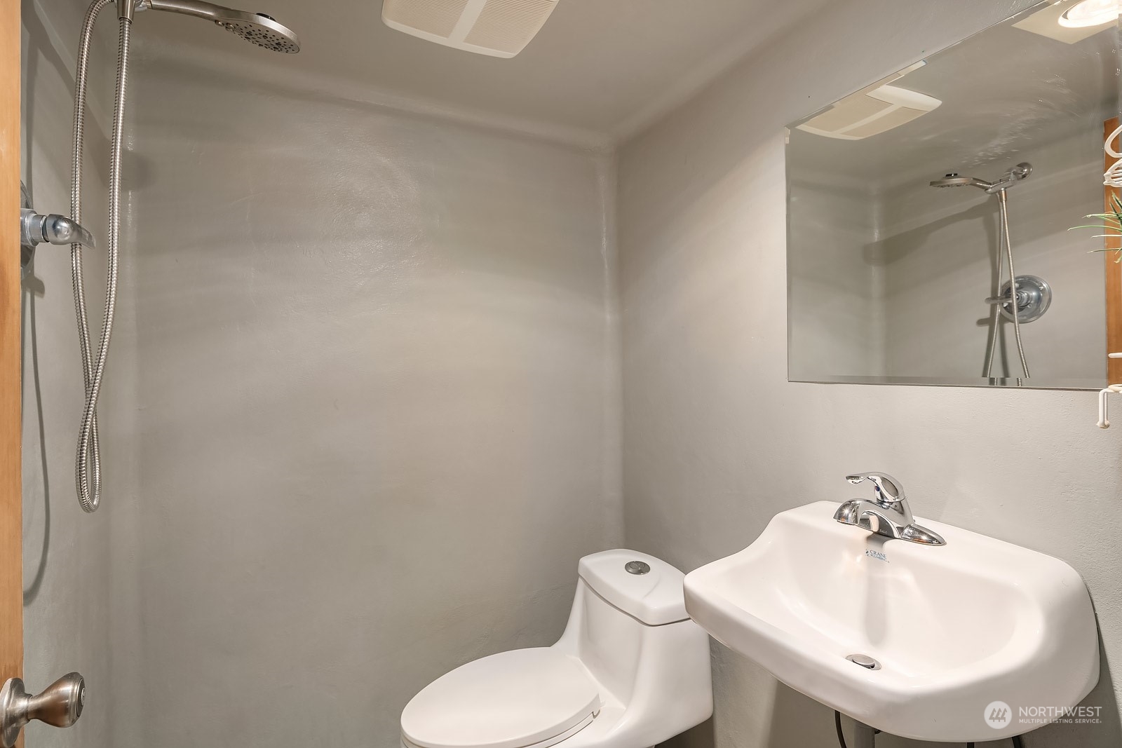 16117 Southeast 145th Place Renton, WA 98059 - Photo 30 of 38 a bathroom with a sink mirror and toilet