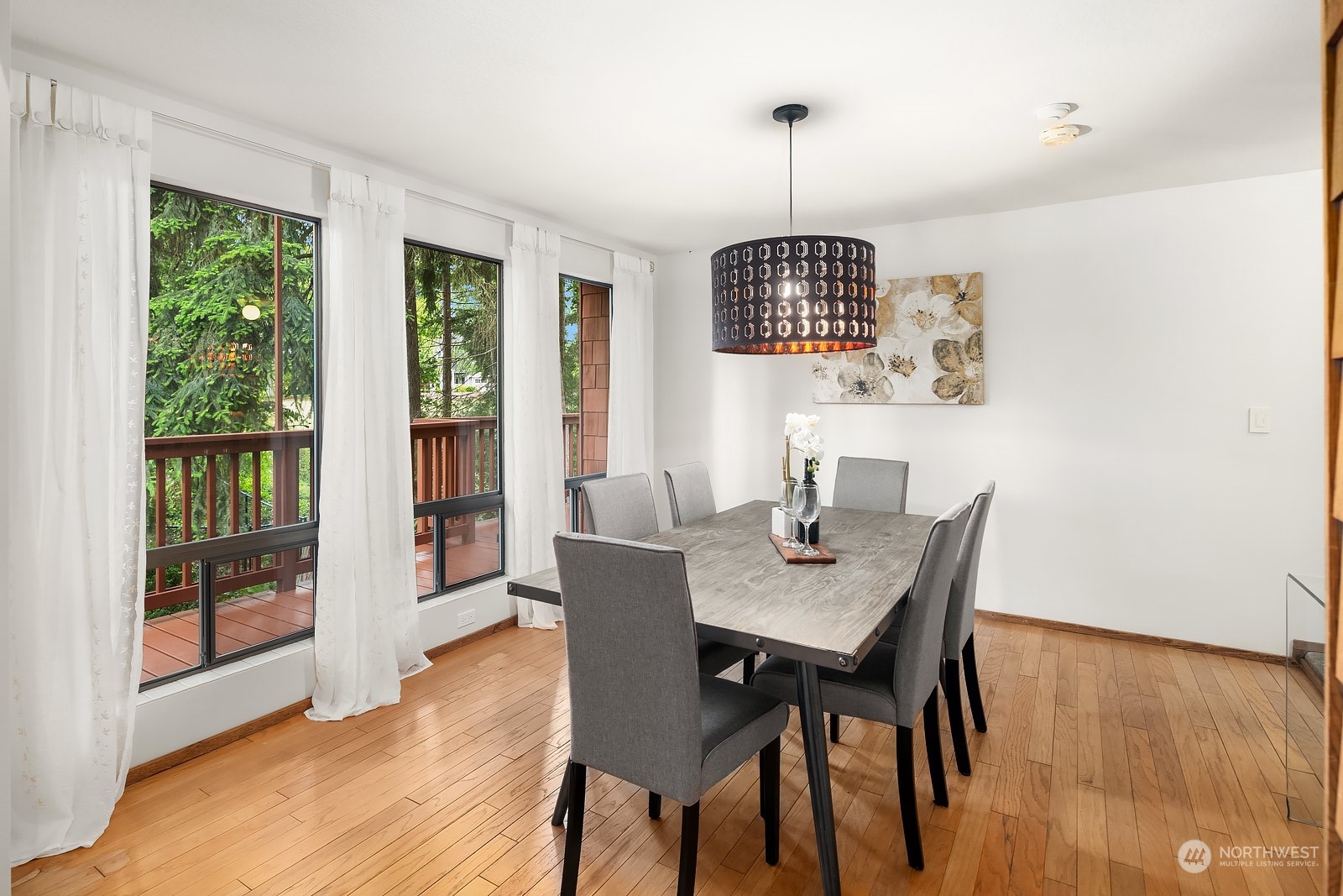 16117 Southeast 145th Place Renton, WA 98059 - Photo 5 of 38 a view of a dining room with furniture window and wooden floor