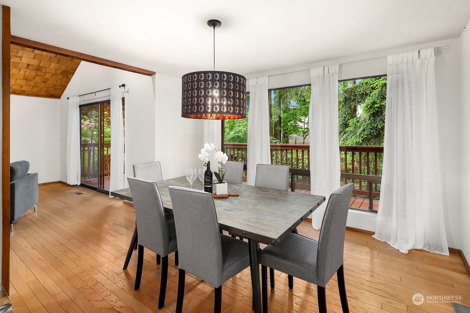 16117 Southeast 145th Place Renton, WA 98059 - Photo 6 of 38 a view of a dining room with furniture window and wooden floor