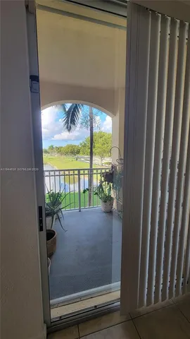 a view of balcony and floor to ceiling window