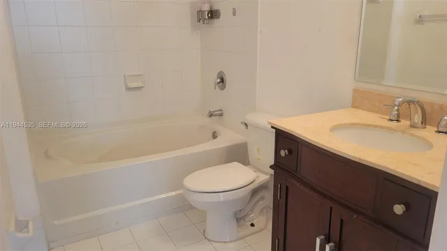 a bathroom with a sink a toilet and a bathtub