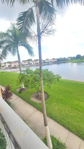 a view of a garden with a lake