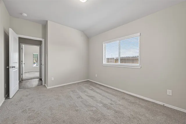 a view of a house with backyard and balcony