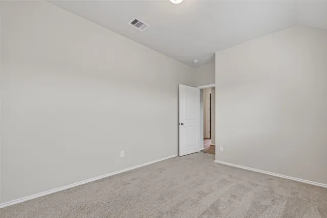 a front view of a house with a garden and deck