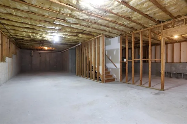 a view of an empty room with wooden walls