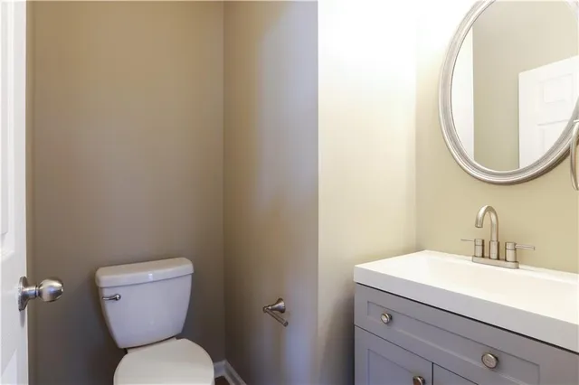 a bathroom with a toilet and a sink