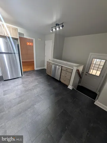 a view of an empty room with a fireplace