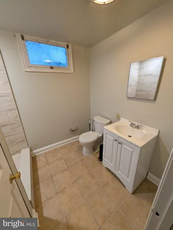 a bathroom with a shower and a sink