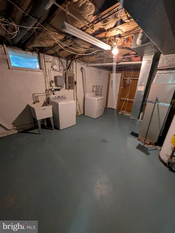 a view of swimming pool with outdoor seating and a shower