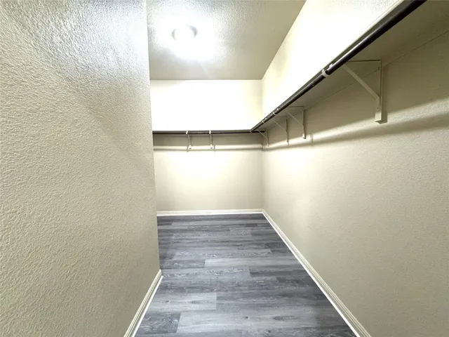 a bathroom with a bathtub and a double vanity sink