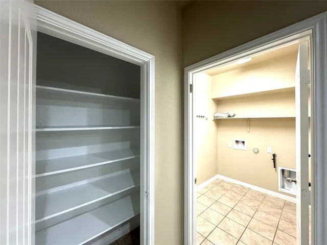 a kitchen with kitchen island granite countertop wooden cabinets granite counter tops and a stove