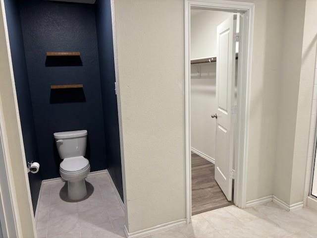 515 Rustic Meadows Trail Princeton, TX 75407 - Photo 19 of 28 a bathroom with a toilet and a sink