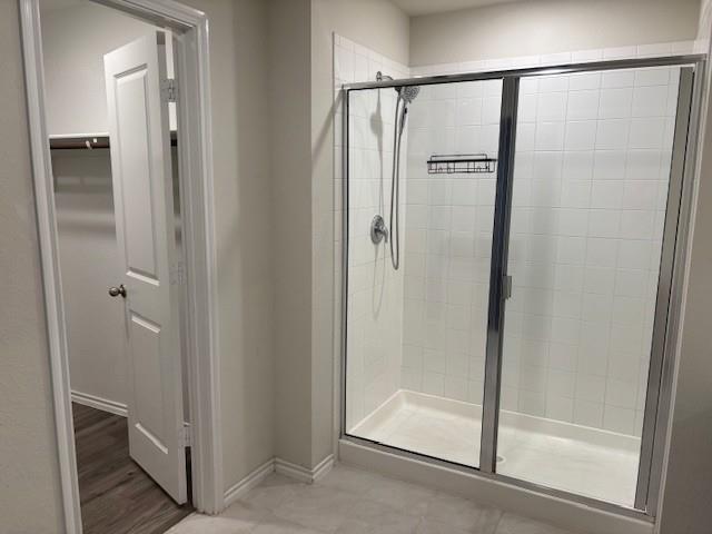 515 Rustic Meadows Trail Princeton, TX 75407 - Photo 20 of 28 a bathroom with a glass shower door
