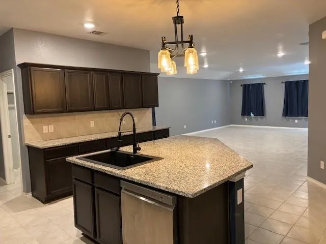 a kitchen with a sink cabinets and window