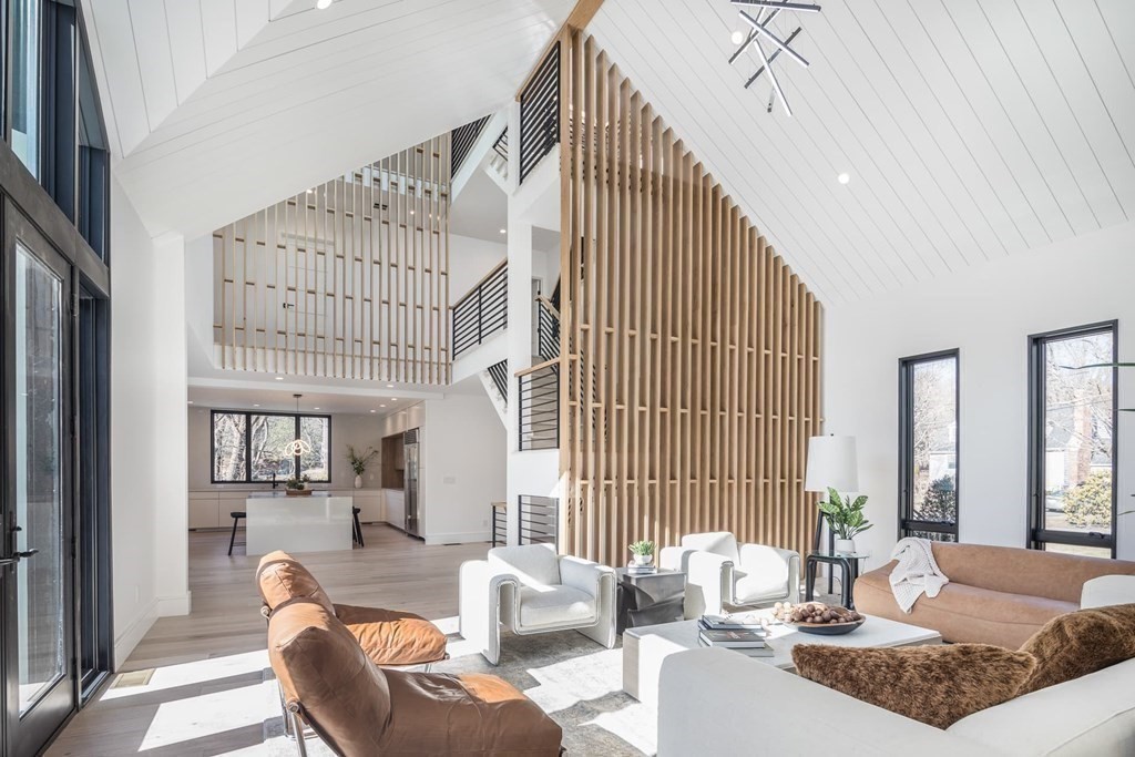 11 Willard Road Weston, MA 02493 - Photo 15 of 42 a living room with furniture and large windows