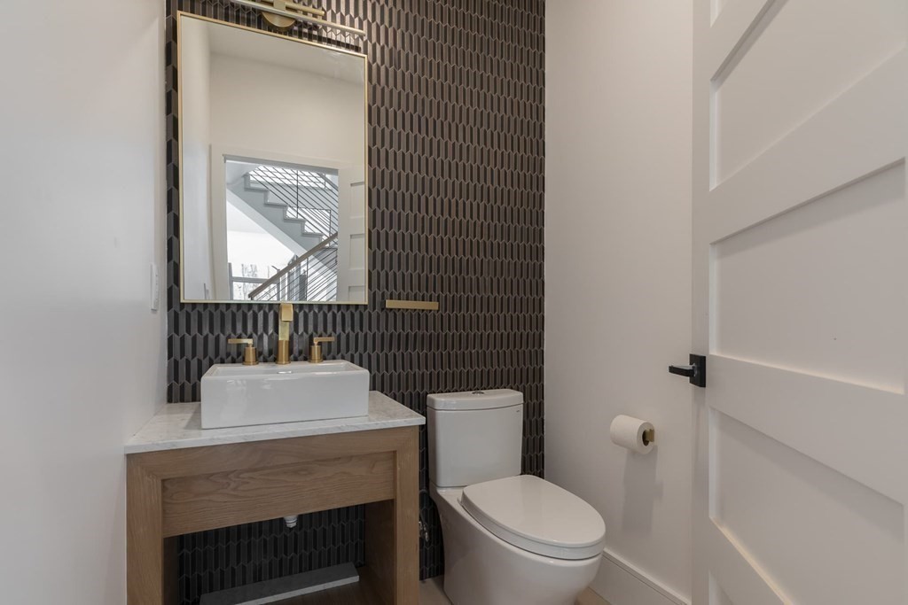 11 Willard Road Weston, MA 02493 - Photo 20 of 42 a bathroom with a toilet a sink and mirror