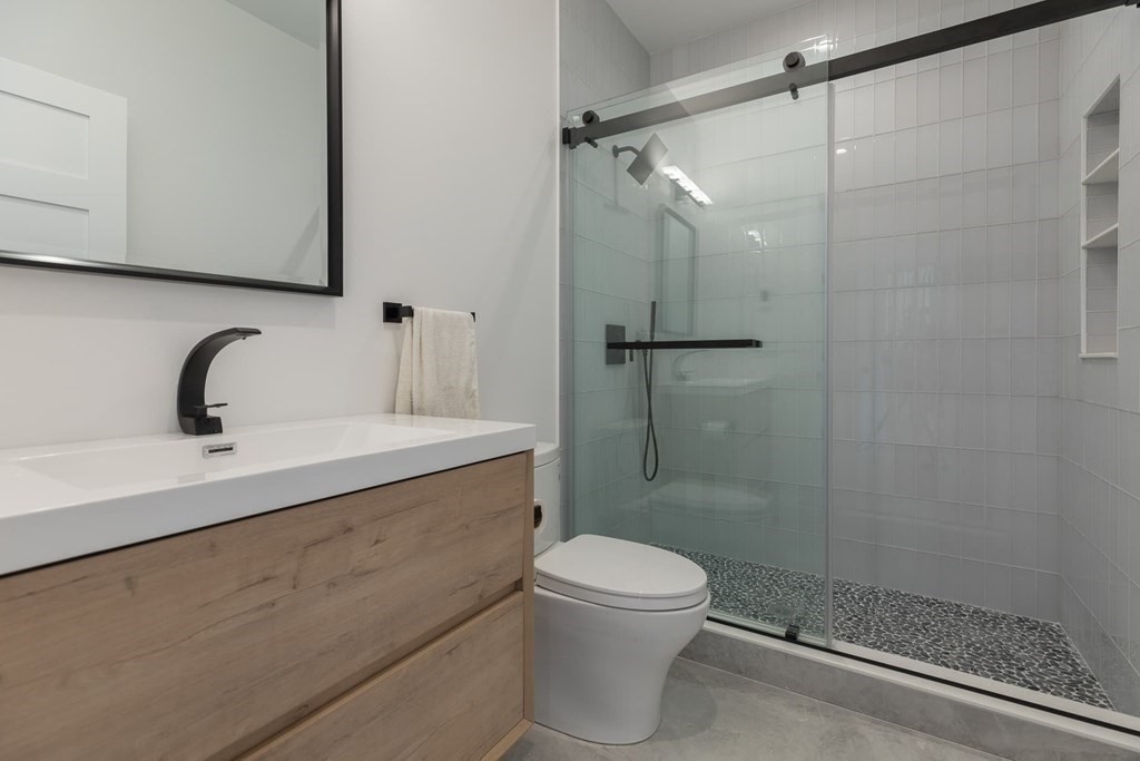 11 Willard Road Weston, MA 02493 - Photo 22 of 42 a bathroom with a shower a toilet and sink