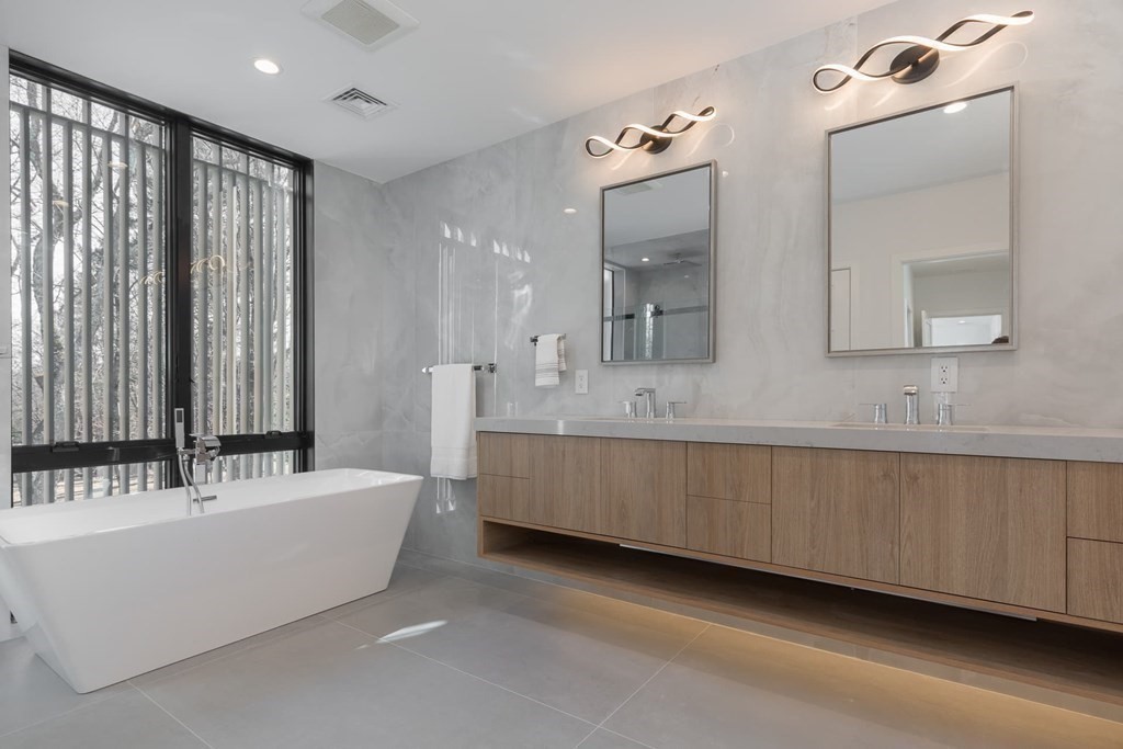 11 Willard Road Weston, MA 02493 - Photo 28 of 42 a bathroom with a double vanity sink mirror and bathtub