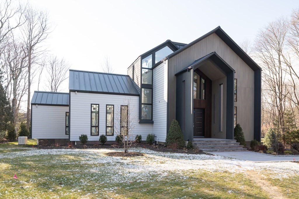 11 Willard Road Weston, MA 02493 - Photo 3 of 42 a view of a house with backyard and trees