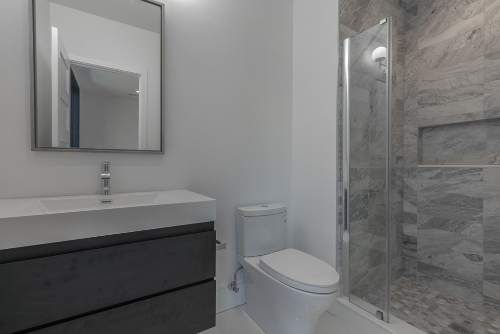11 Willard Road Weston, MA 02493 - Photo 31 of 42 a bathroom with a sink a toilet and shower