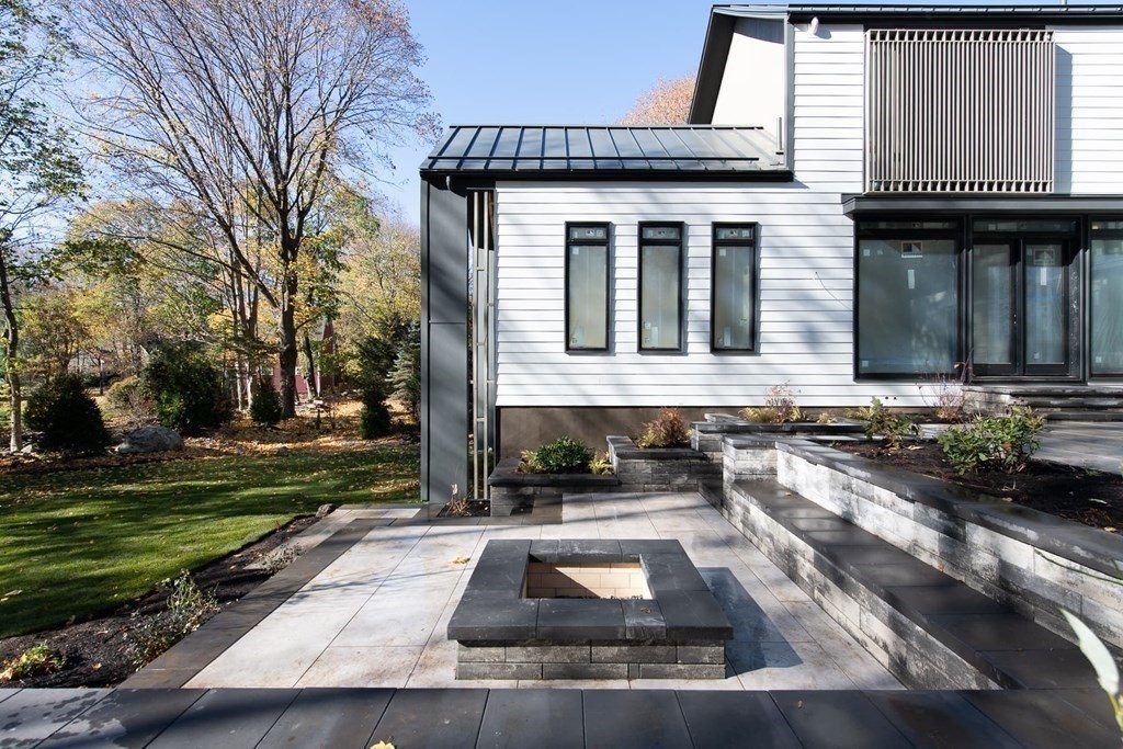 11 Willard Road Weston, MA 02493 - Photo 4 of 42 a front view of a house with a yard