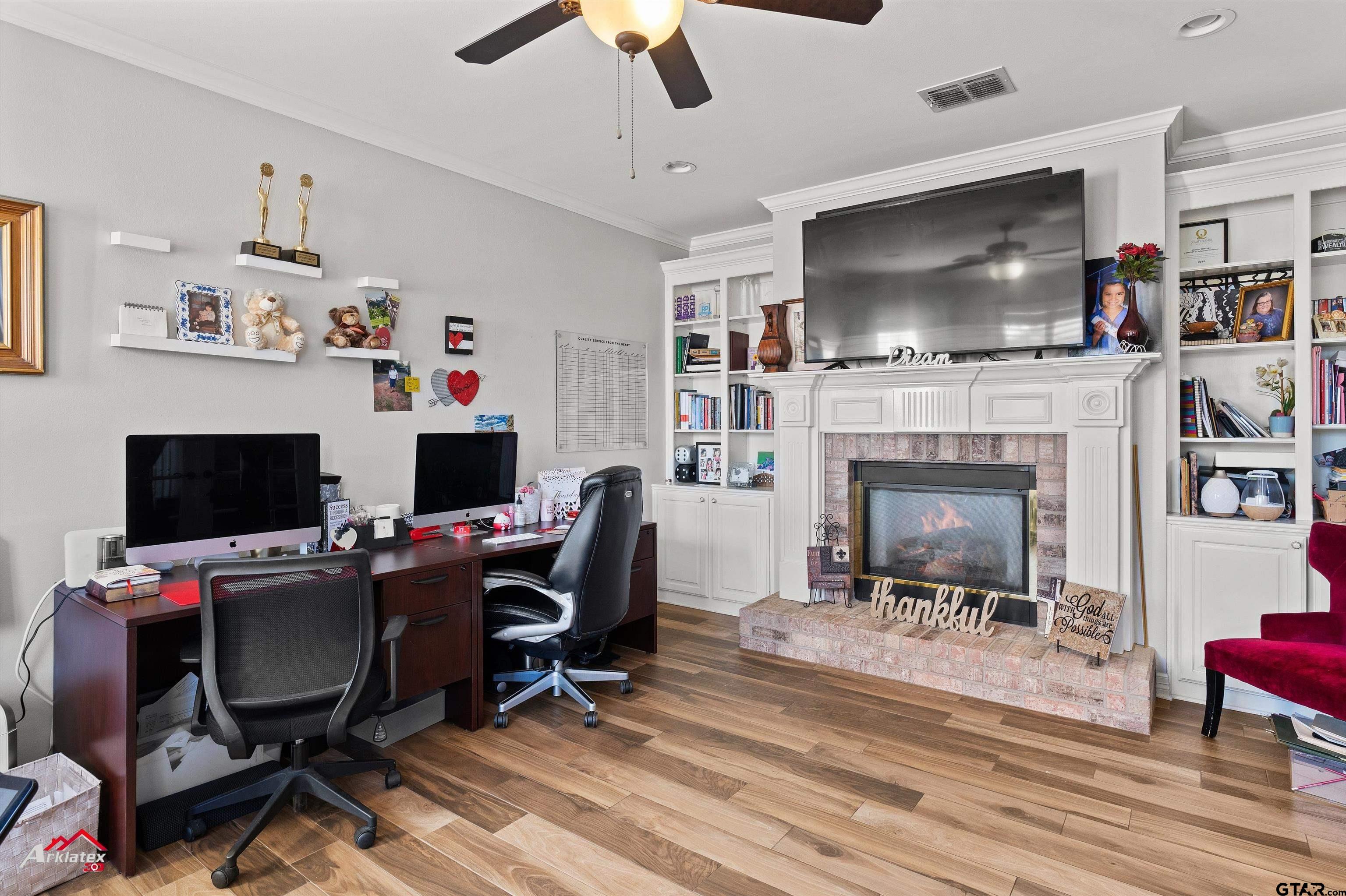 3815 Holly Ridge Drive Longview, TX 75605 - Photo 8 of 22 a view of a livingroom with workspace and a fireplace