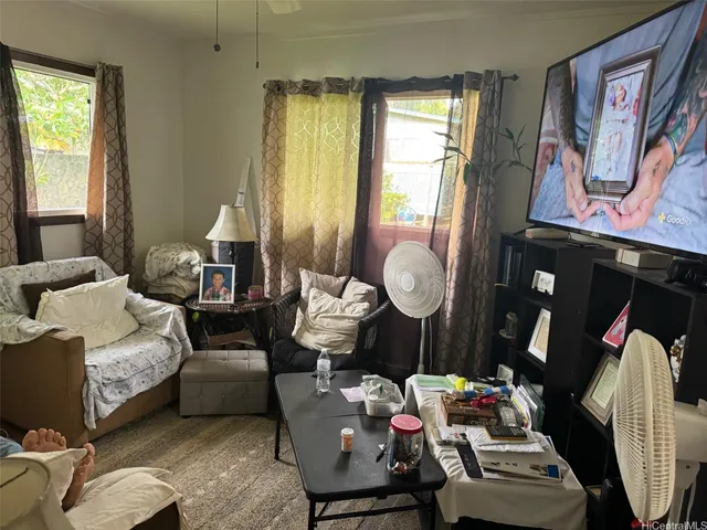 a bedroom with bed and a window