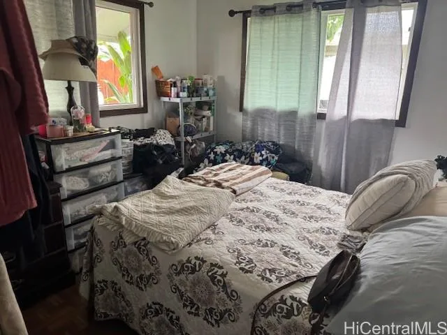 a bedroom with a bed and dresser