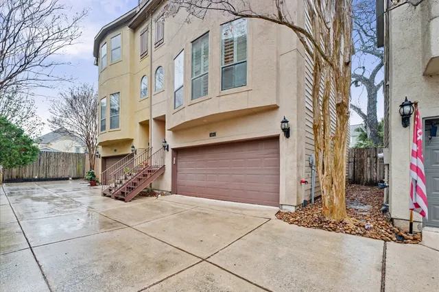 a view of a brick house with many windows