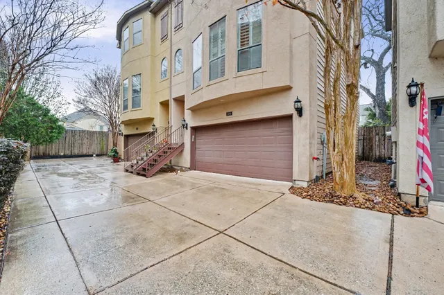 a front view of a building with a yard