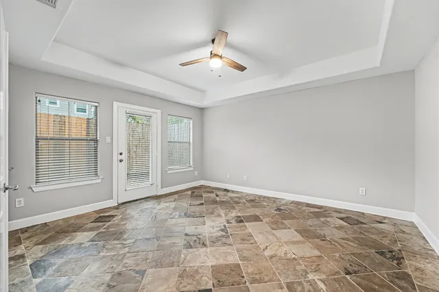 a view of an empty room with a window