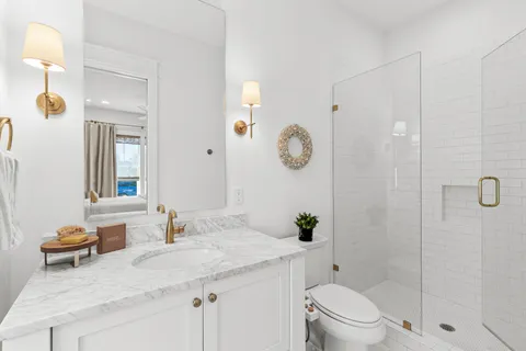 a view of an empty room and wooden floor