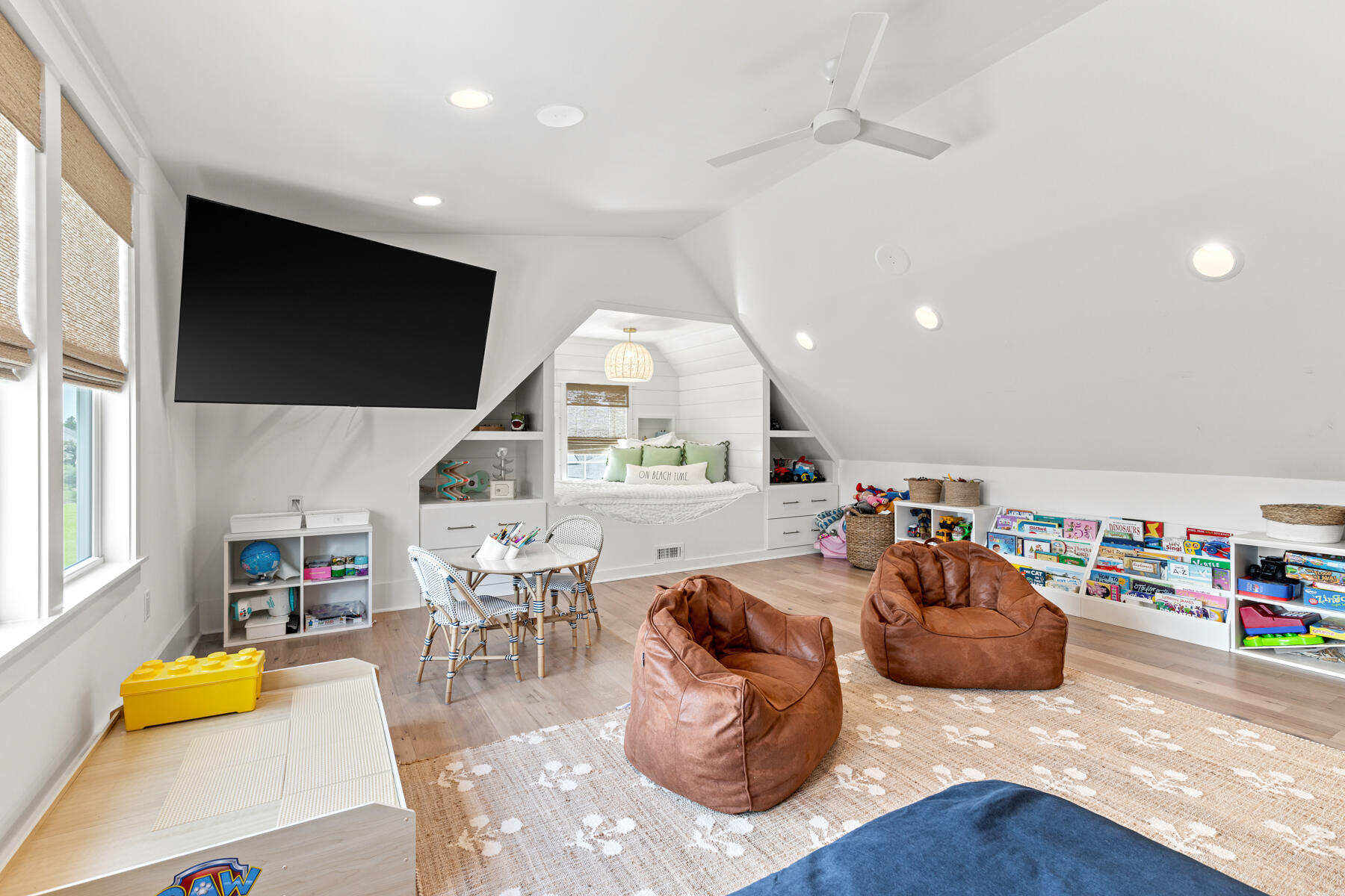 231 Catface Dr Inlet Beach Inlet Beach, FL 32461 - Photo 28 of 45 a living room with furniture a flat screen tv and a large window