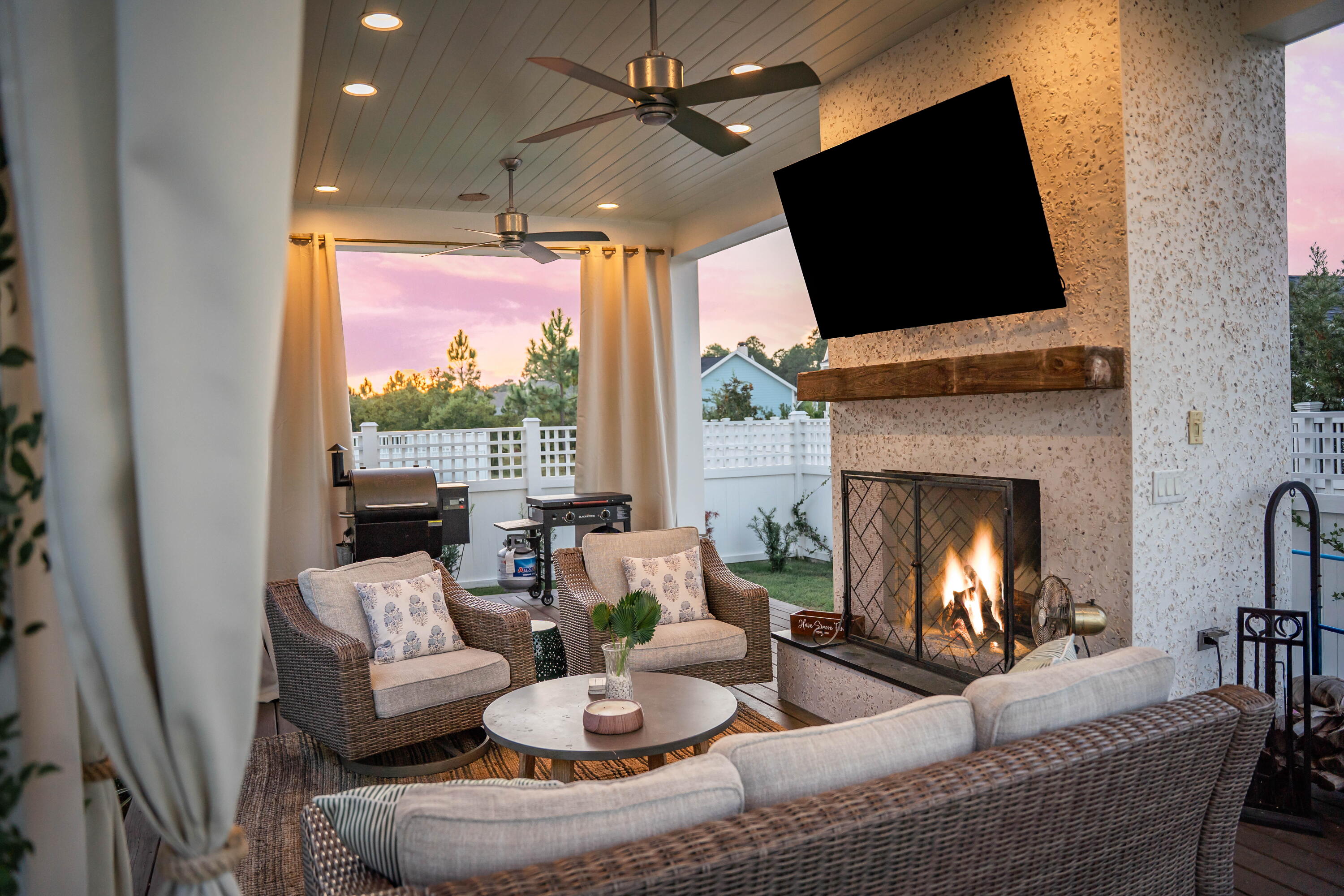 231 Catface Dr Inlet Beach Inlet Beach, FL 32461 - Photo 35 of 45 a living room with furniture a fireplace and a flat screen tv