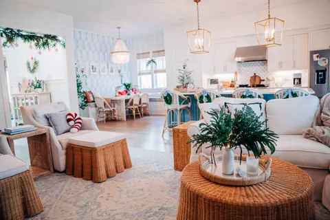 a dining room with furniture potted plants and wooden floor