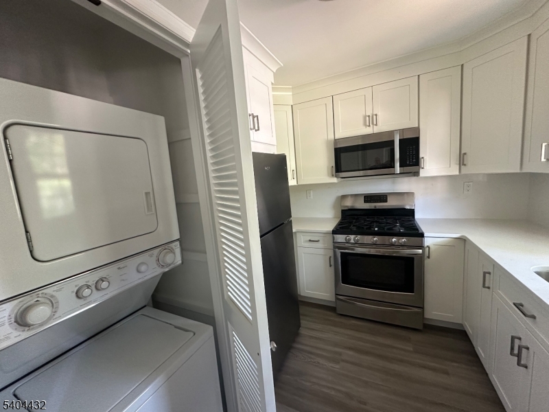 151 Osprey Road Hackettstown, NJ 07840 - Photo 3 of 9 a kitchen with white cabinets and stainless steel appliances