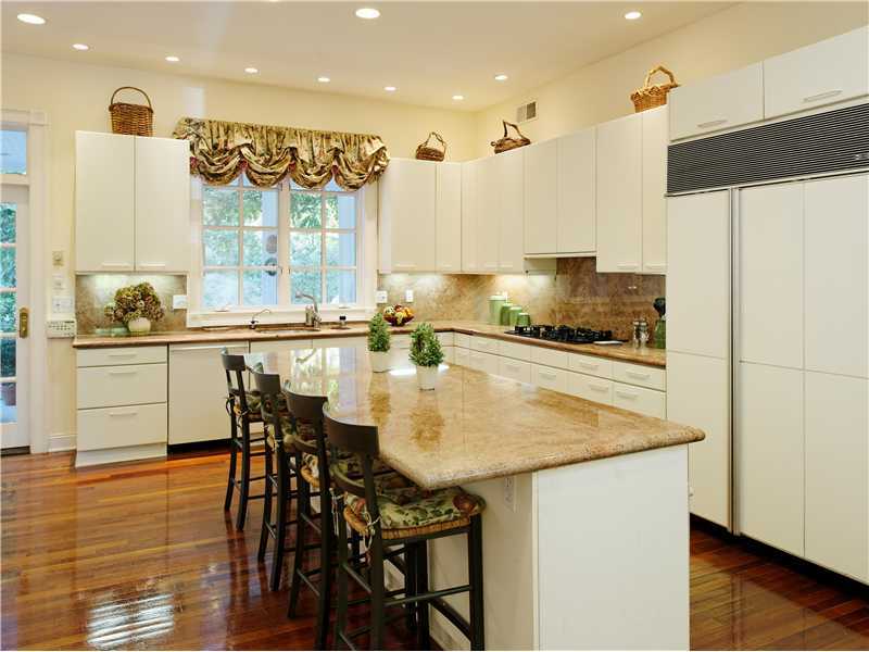 56 Dingletown Road Greenwich, CT 06830 - Photo 8 of 20 a kitchen with stainless steel appliances granite countertop a table chairs sink and cabinets
