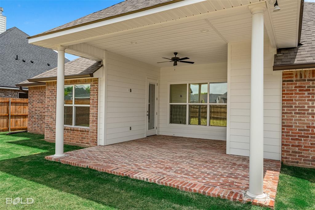 304 Prien Lk Loop Bossier City, LA 71111 - Photo 36 of 39 Covered patio featuring a brick paver surface, white columns, and a ceiling fan