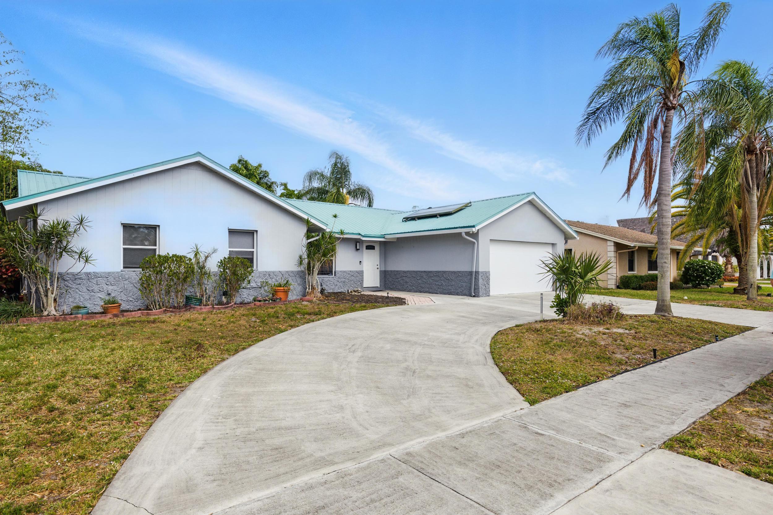 5183 Beechwood Road Delray Beach, FL 33484 - Photo 2 of 48 Exterior Front w/ Circular Driveway
