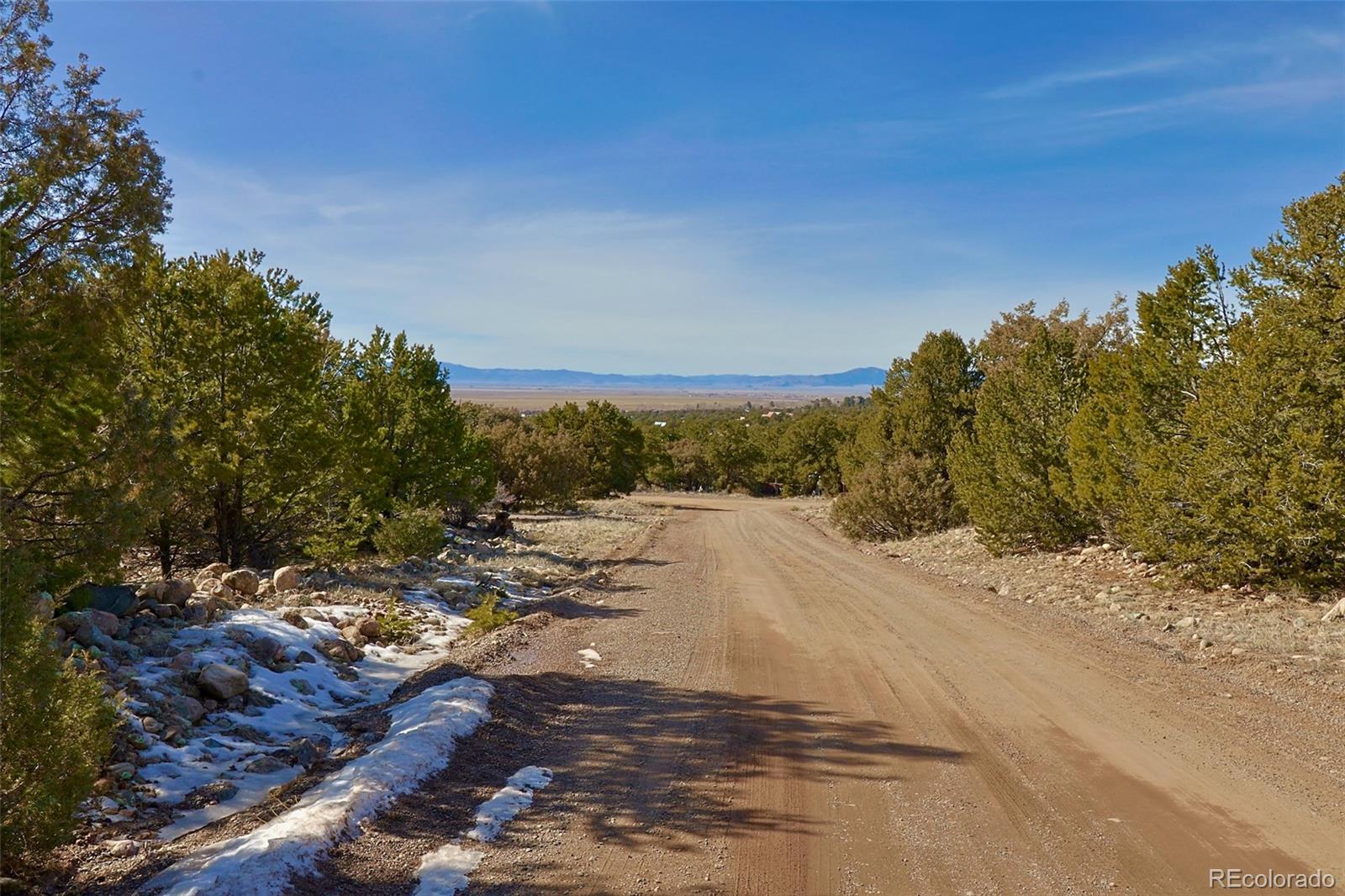 2130 Big Ranch Overlook, Unit OVERLOOK Crestone, CO 81131 - Photo 5 of 6 a view of a road with trees in the background