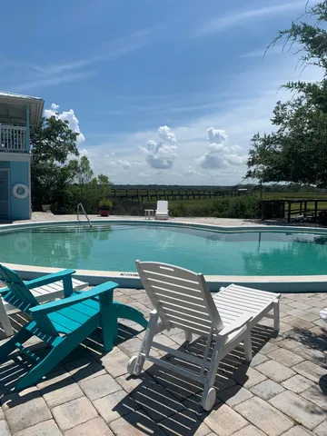 a view of a wooden deck and a lake view