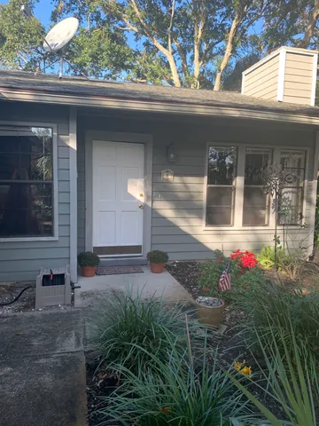 a vase of flowers sitting in front of a window