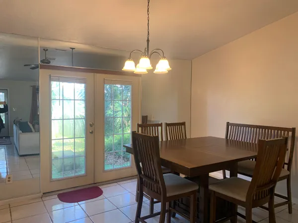 a view of a dining room with furniture and window