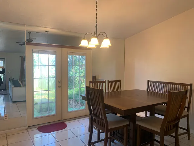 a view of a dining room with furniture and window