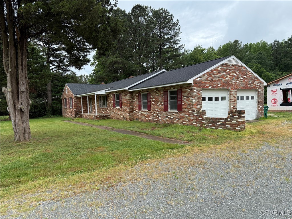 8900 Strath Road Henrico, VA 23231 - Photo 3 of 49 Ranch-style house with a front yard, gravel drivew