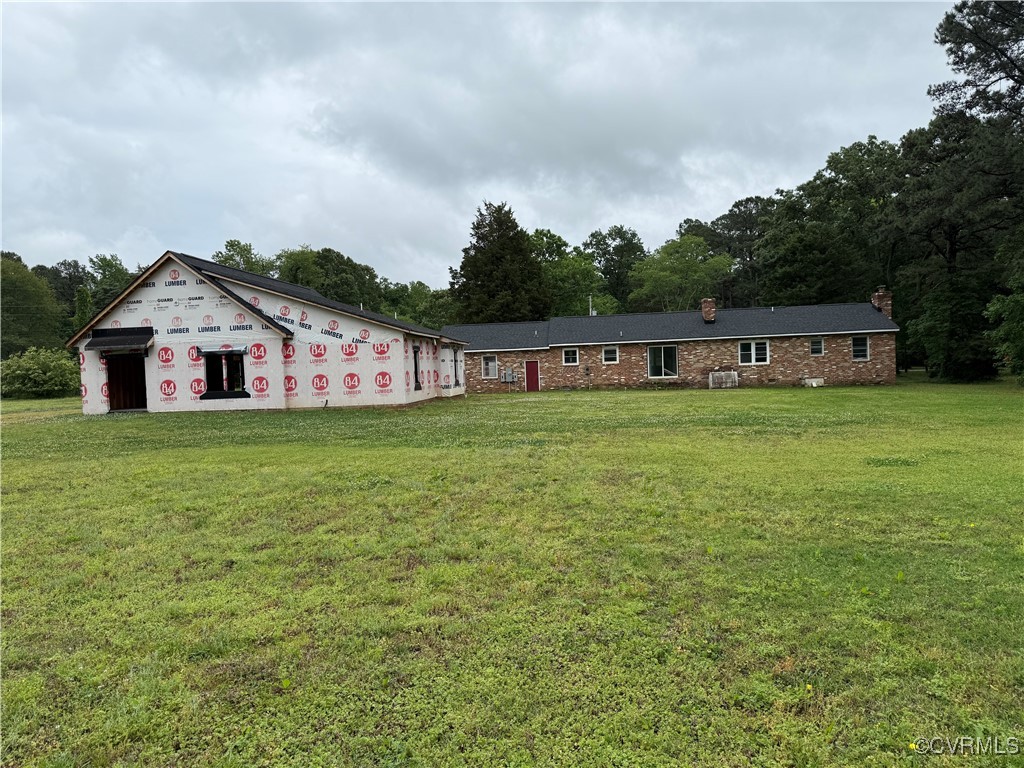 8900 Strath Road Henrico, VA 23231 - Photo 7 of 49 View of front facade featuring a chimney and a fro