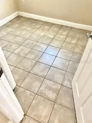 a view of a room with white walls