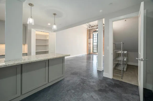 a view of a bathroom with a sink and mirror