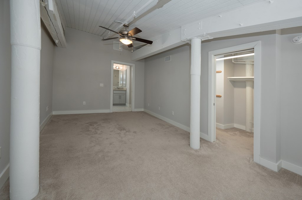 1201 Front Avenue, Unit 514 Columbus, GA 31901 - Photo 28 of 39 a view of an empty room with a chandelier fan